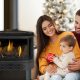Family next to a gas fireplace